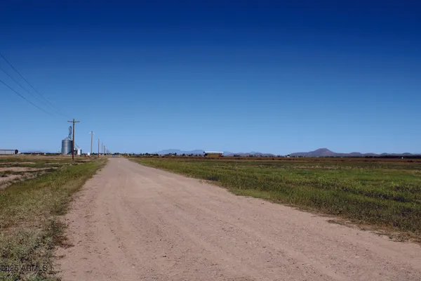 a view of a lake and green valley