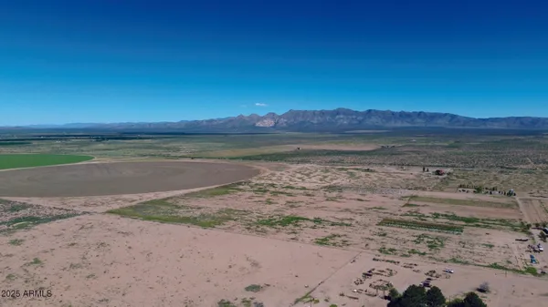 a view of an ocean beach and a mountain