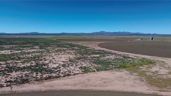 a view of an ocean beach and mountain