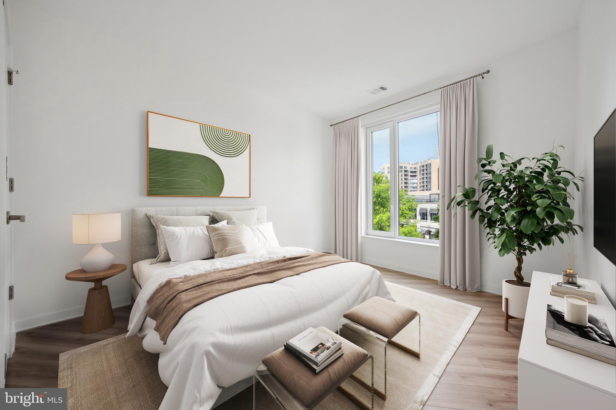 5300 Wisconsin Avenue Northwest, Unit 213/VARIES Washington, DC 20015 - Photo 12 of 29 a bedroom with a bed and a window