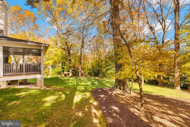 a bedroom with furniture and large windows