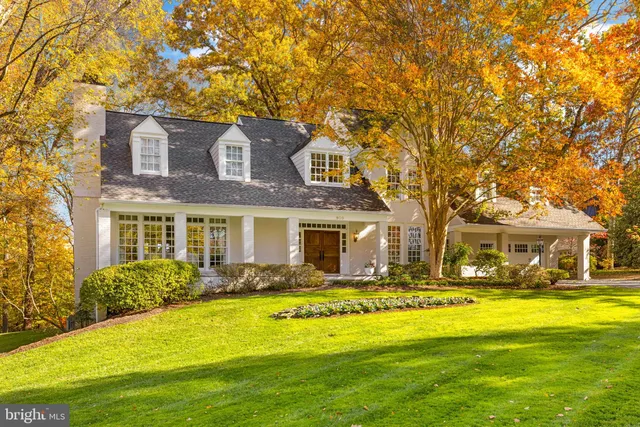 a front view of a building with a garden