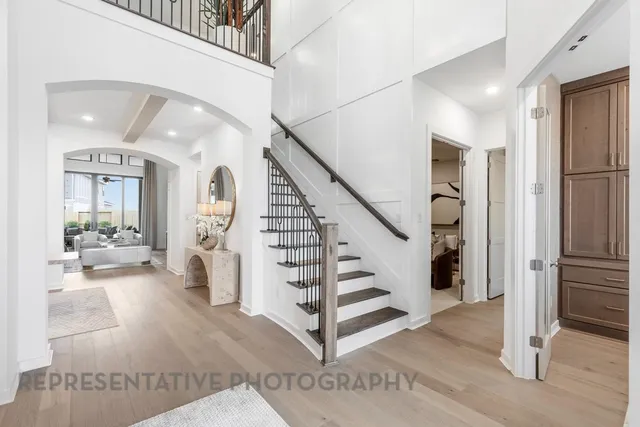 a dining room with furniture and wooden floor
