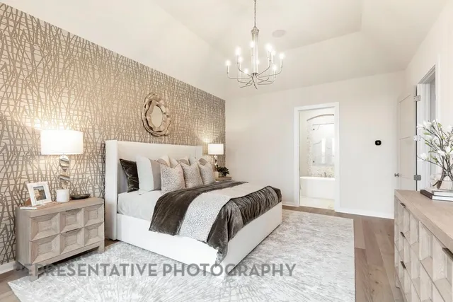 a spacious bedroom with a bed and a couch