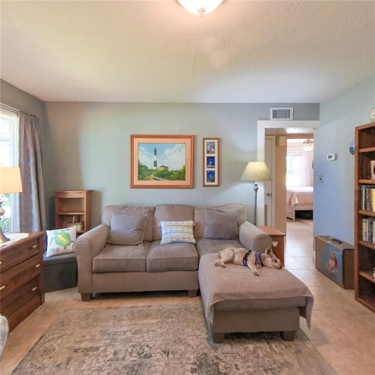 120 Rhode Island Street Edgewater, FL 32132 - Photo 13 of 28 a living room with furniture and a large window