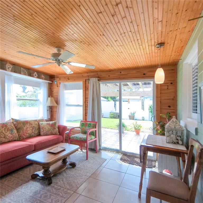 120 Rhode Island Street Edgewater, FL 32132 - Photo 15 of 28 a living room with furniture and a large window