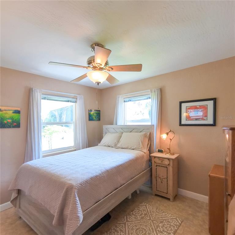 120 Rhode Island Street Edgewater, FL 32132 - Photo 18 of 28 a bedroom with a bed and a window