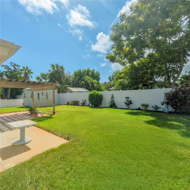 120 Rhode Island Street Edgewater, FL 32132 - Photo 3 of 28 a view of a swimming pool with a yard