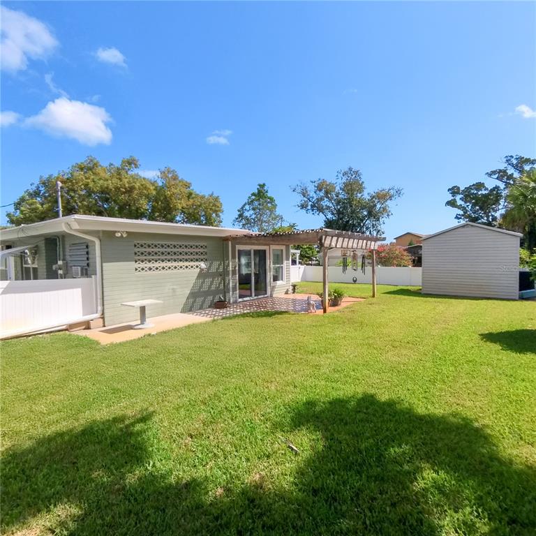 120 Rhode Island Street Edgewater, FL 32132 - Photo 4 of 28 a front view of house with yard and green space