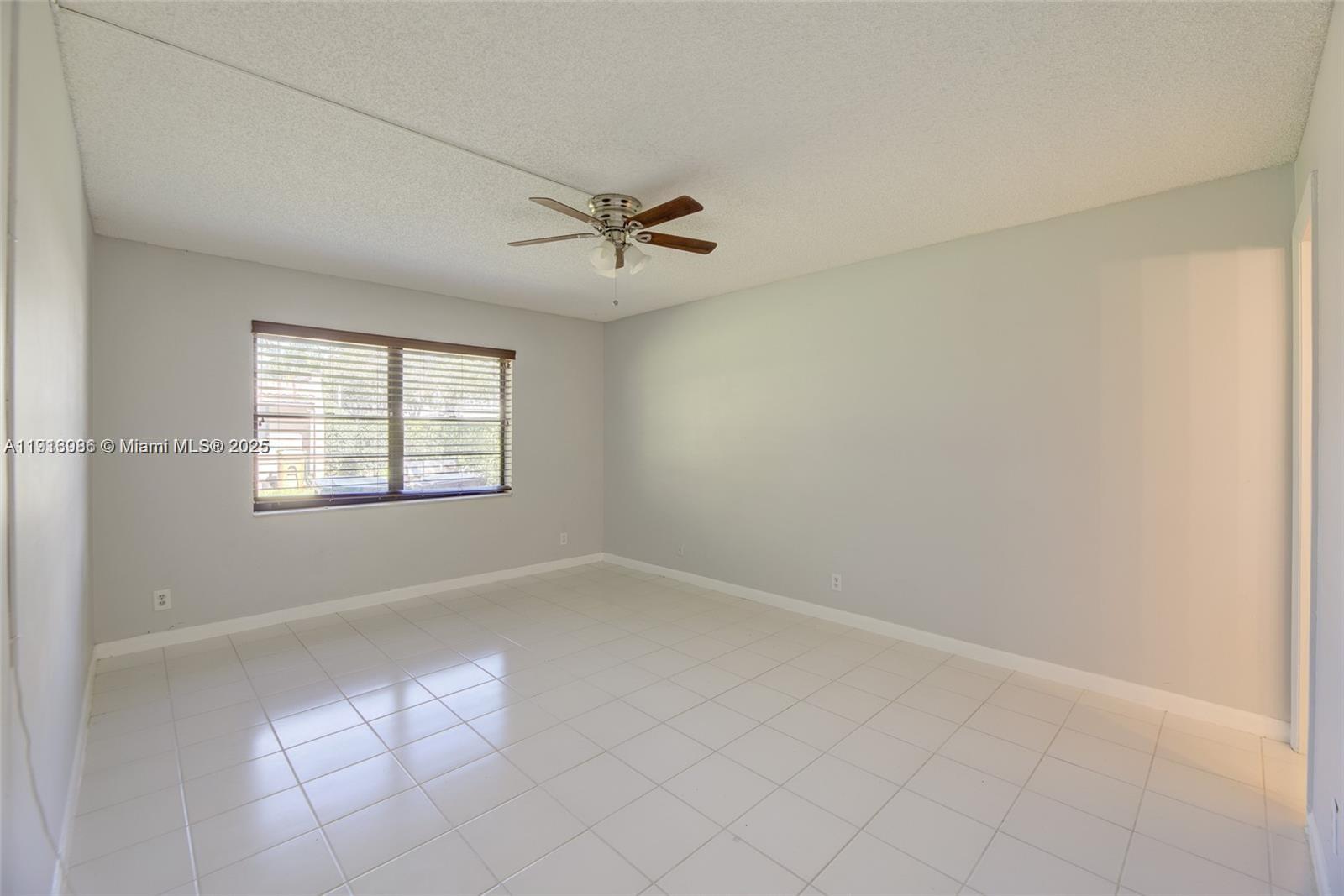 31 Cortez Way, Unit 543 Davie, FL 33324 - Photo 17 of 36 an empty room with windows and fan
