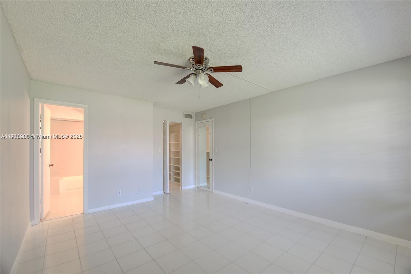 31 Cortez Way, Unit 543 Davie, FL 33324 - Photo 19 of 36 wooden floor in an empty room