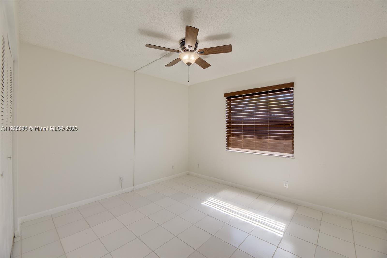 31 Cortez Way, Unit 543 Davie, FL 33324 - Photo 24 of 36 a view of room with window and ceiling fan