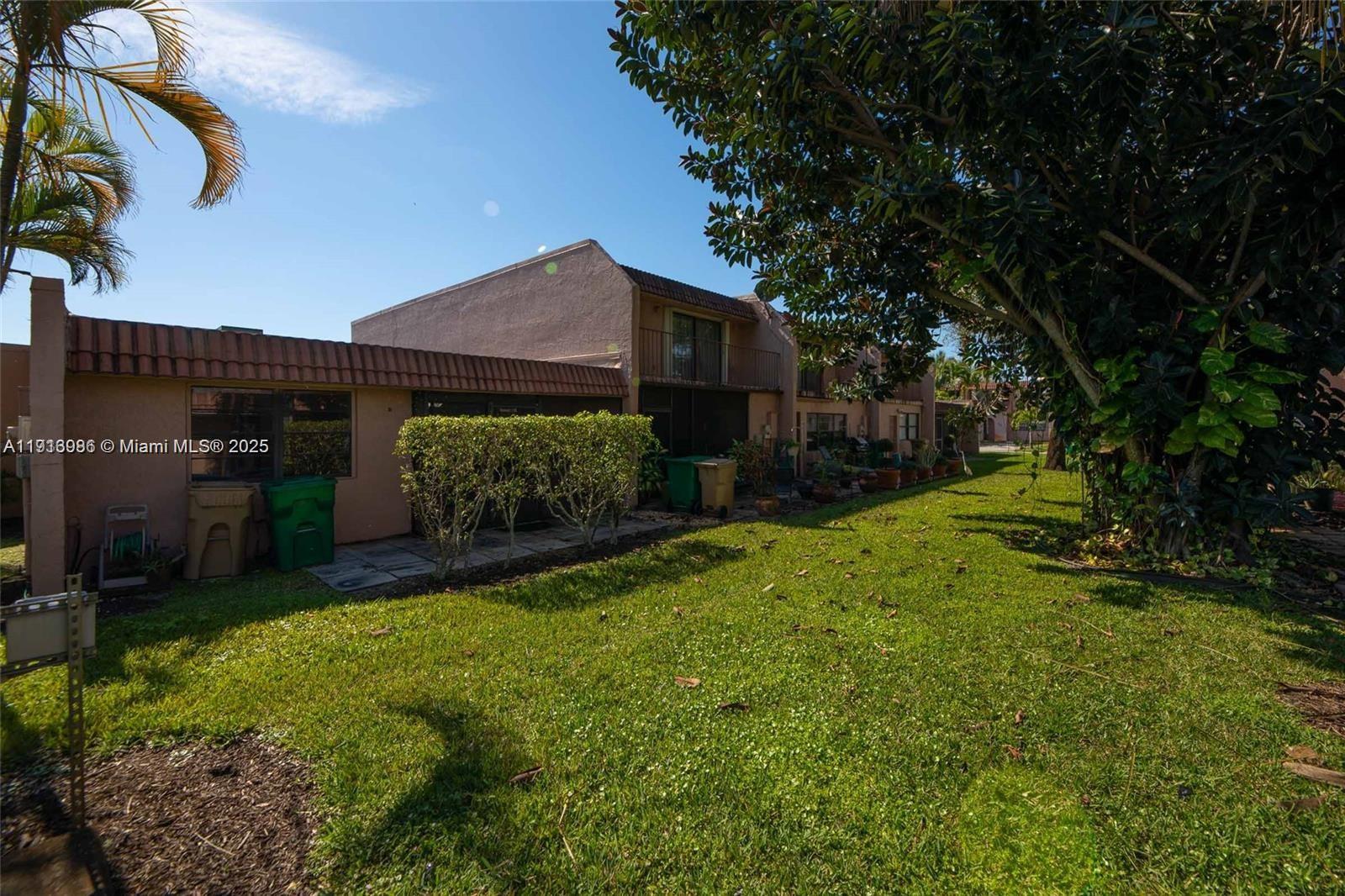31 Cortez Way, Unit 543 Davie, FL 33324 - Photo 3 of 36 a view of a back yard of the house