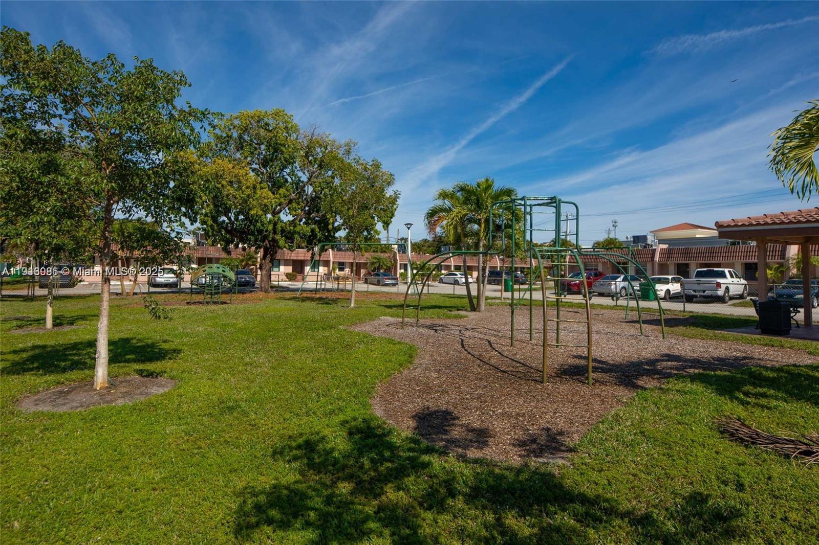 31 Cortez Way, Unit 543 Davie, FL 33324 - Photo 35 of 36 a view of a park with swings