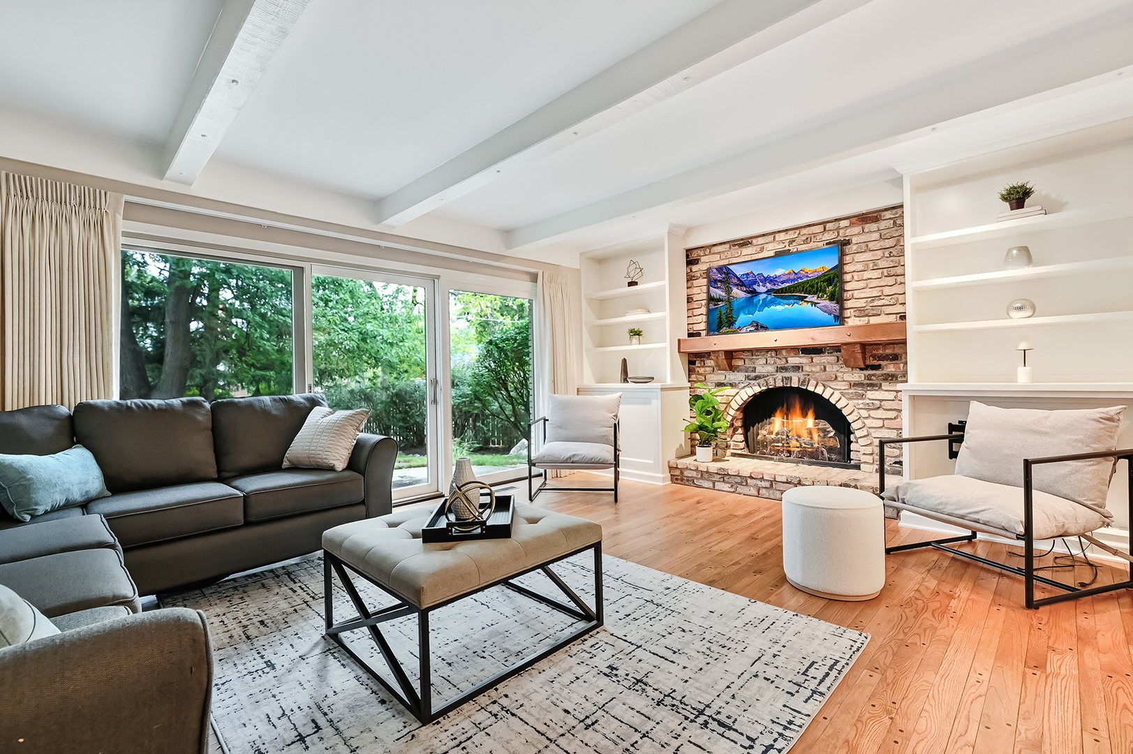 118 North Grant Street Hinsdale, IL 60521 - Photo 11 of 30 a living room with furniture a fireplace and a floor to ceiling window