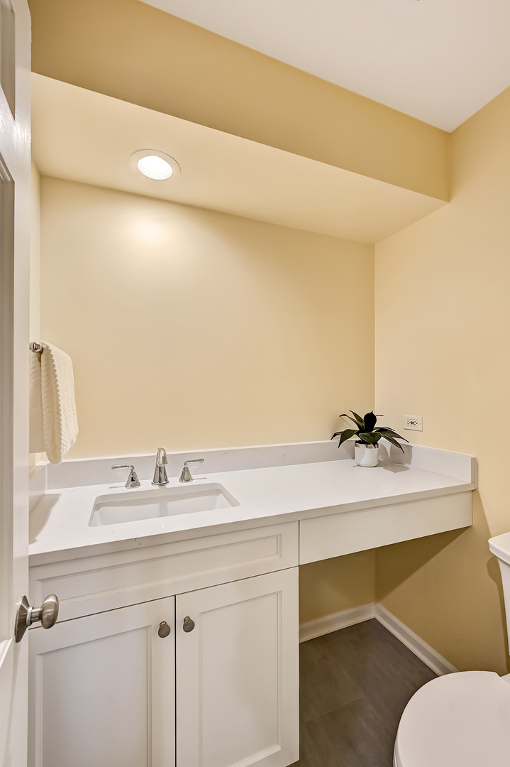 118 North Grant Street Hinsdale, IL 60521 - Photo 17 of 30 a bathroom with a sink and a mirror