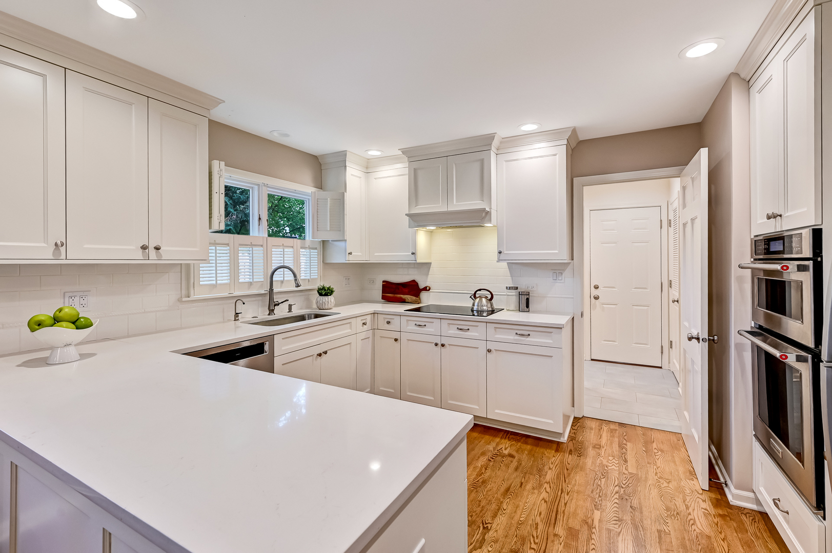 118 North Grant Street Hinsdale, IL 60521 - Photo 9 of 30 a kitchen with white cabinets and white appliances