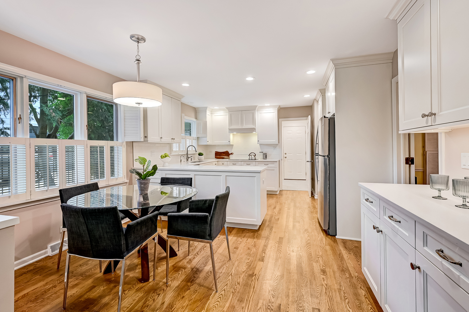118 North Grant Street Hinsdale, IL 60521 - Photo 10 of 30 a view of a dining room and livingroom with furniture wooden floor a chandelier