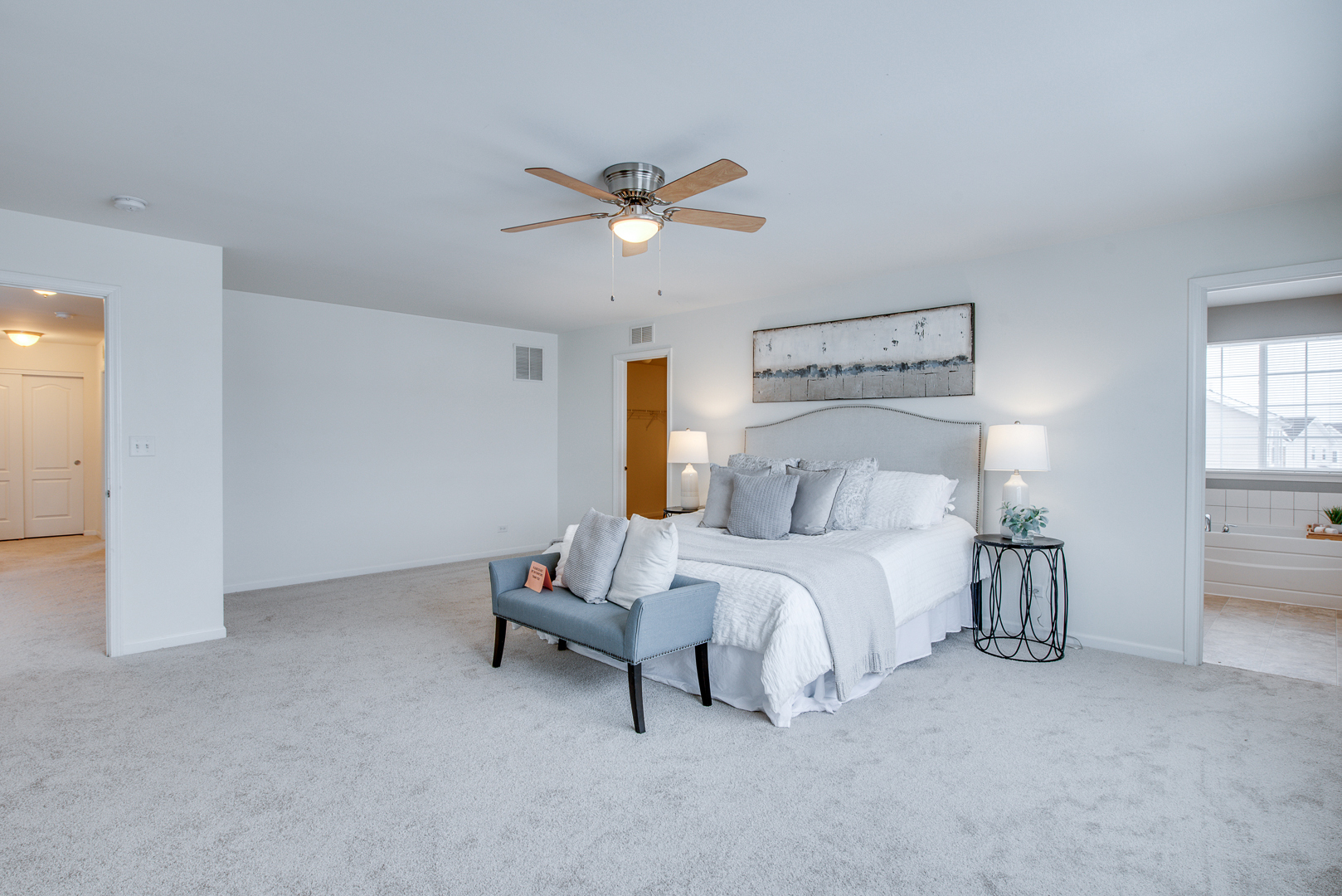 12811 Conifer Street Plainfield, IL 60585 - Photo 20 of 47 a bed room with a bed and a chandelier