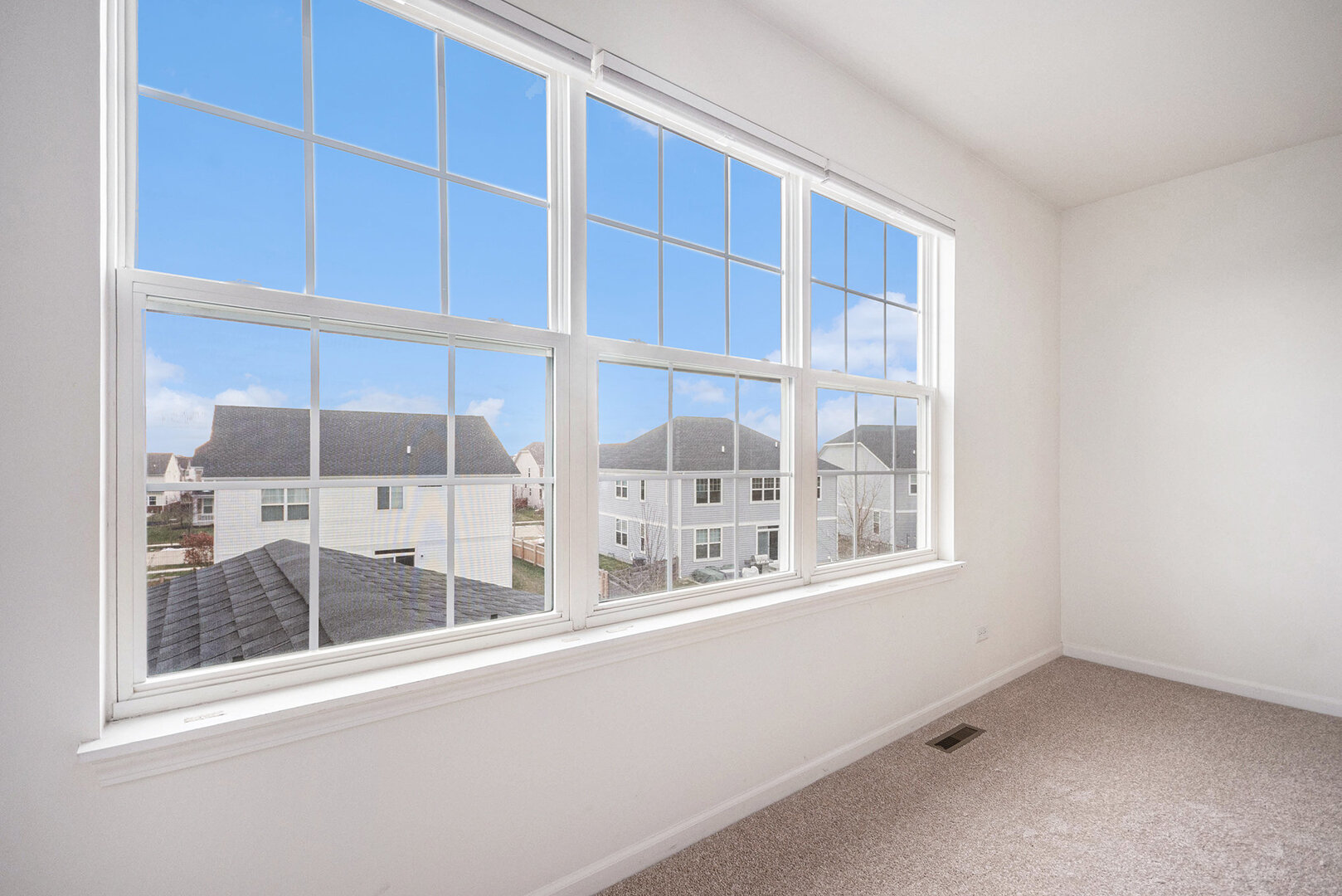 12811 Conifer Street Plainfield, IL 60585 - Photo 21 of 47 a view of an empty room with a window