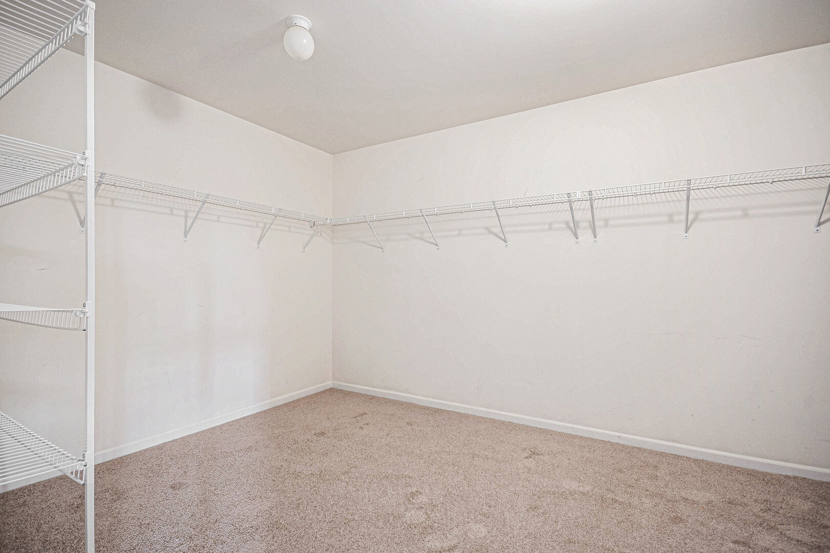 12811 Conifer Street Plainfield, IL 60585 - Photo 22 of 47 a view of a room with racks on the wall