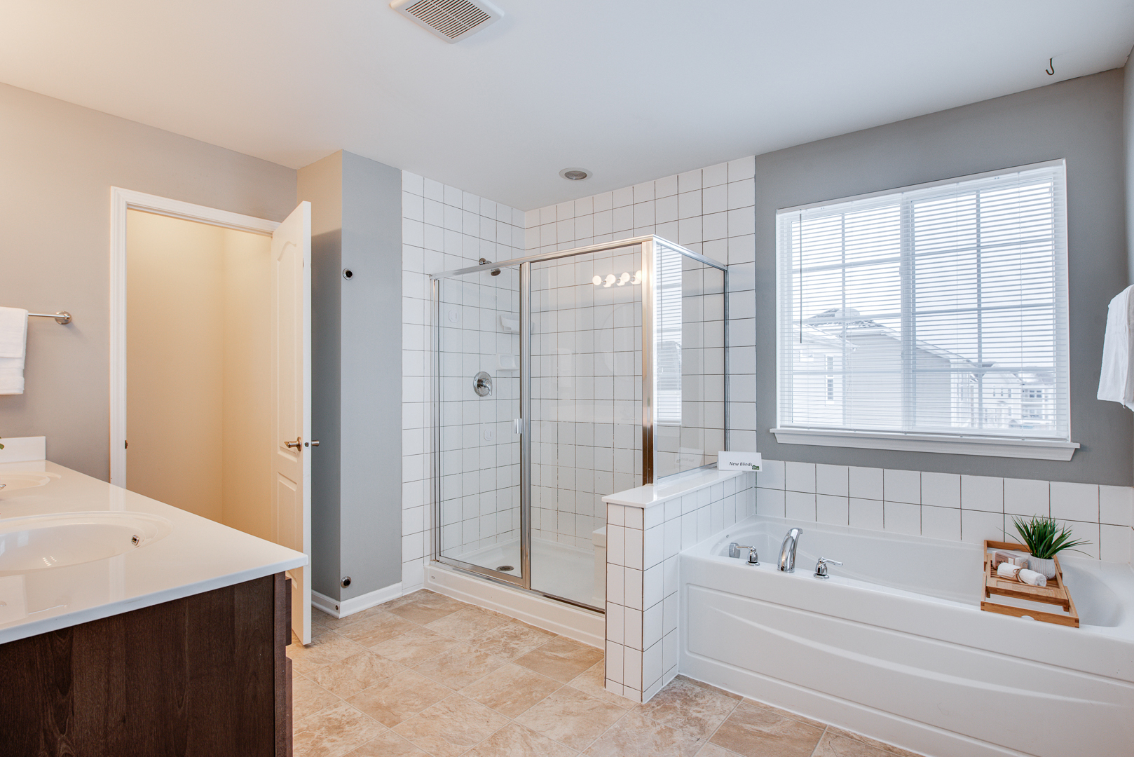 12811 Conifer Street Plainfield, IL 60585 - Photo 23 of 47 a bathroom with a bathtub and a shower