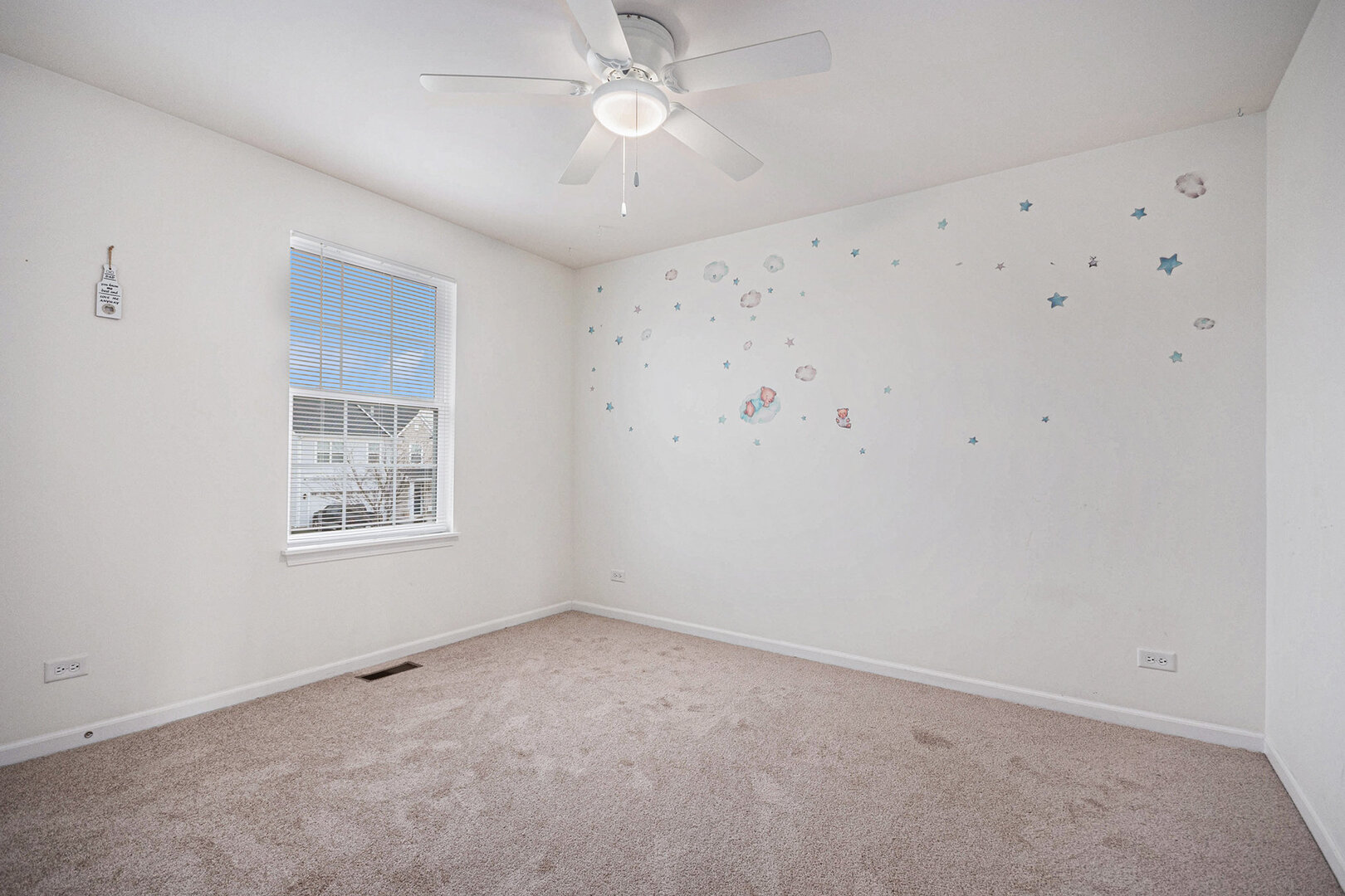 12811 Conifer Street Plainfield, IL 60585 - Photo 25 of 47 an empty room with a window and a fan