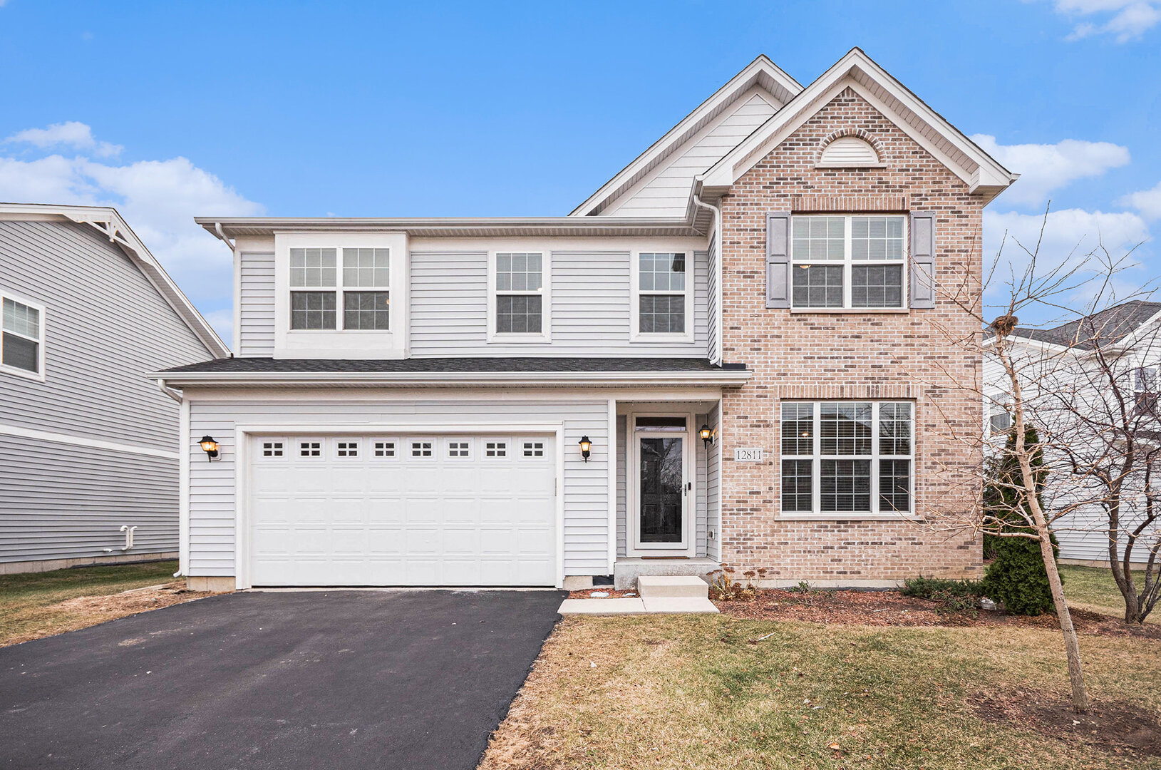 12811 Conifer Street Plainfield, IL 60585 - Photo 30 of 47 a front view of a house with a yard