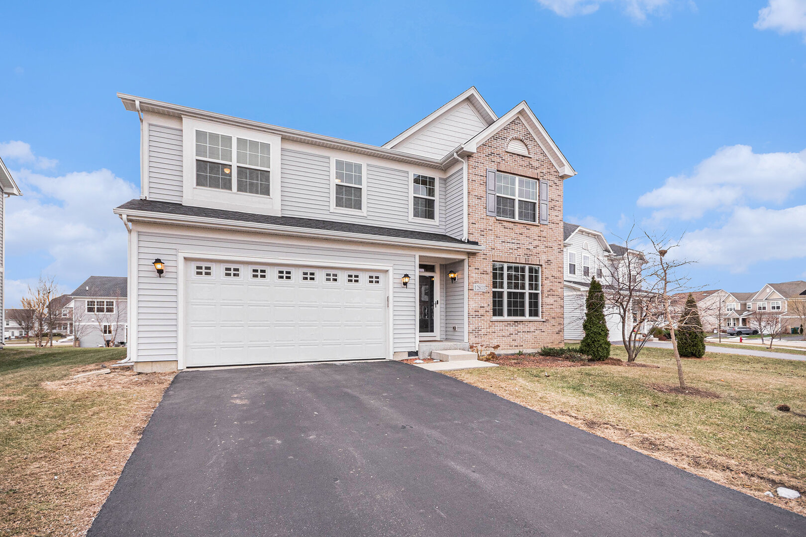 12811 Conifer Street Plainfield, IL 60585 - Photo 31 of 47 a view of a house with a yard