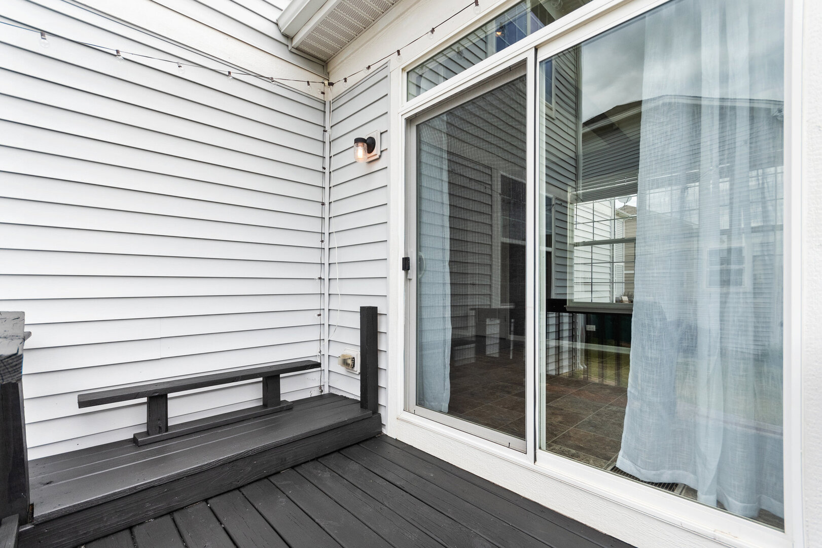 12811 Conifer Street Plainfield, IL 60585 - Photo 32 of 47 a view of a balcony with door and wooden floor