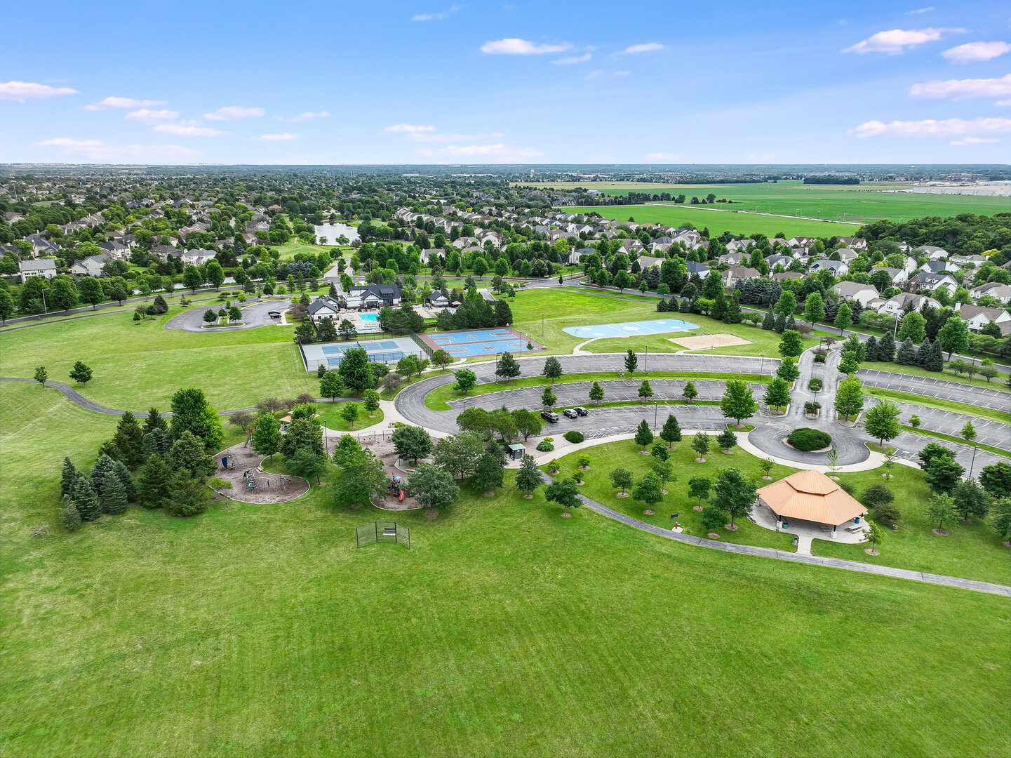 12811 Conifer Street Plainfield, IL 60585 - Photo 42 of 47 a view of a city with green field and mountains