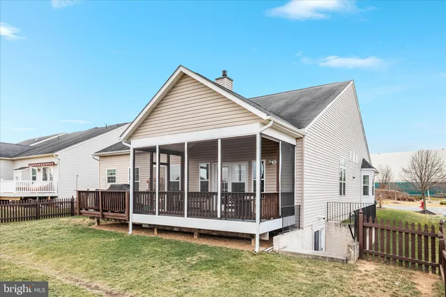 an aerial view of a house with swimming pool garden and patio