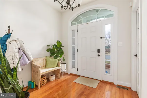 a living room with furniture and a book shelf