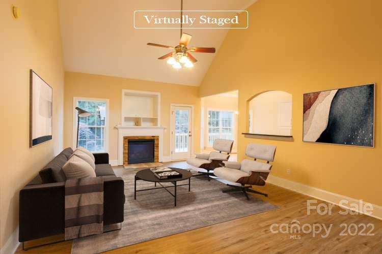 142 Princess Loop Troutman, NC 28166 - Photo 2 of 22 a living room with furniture and a fireplace
