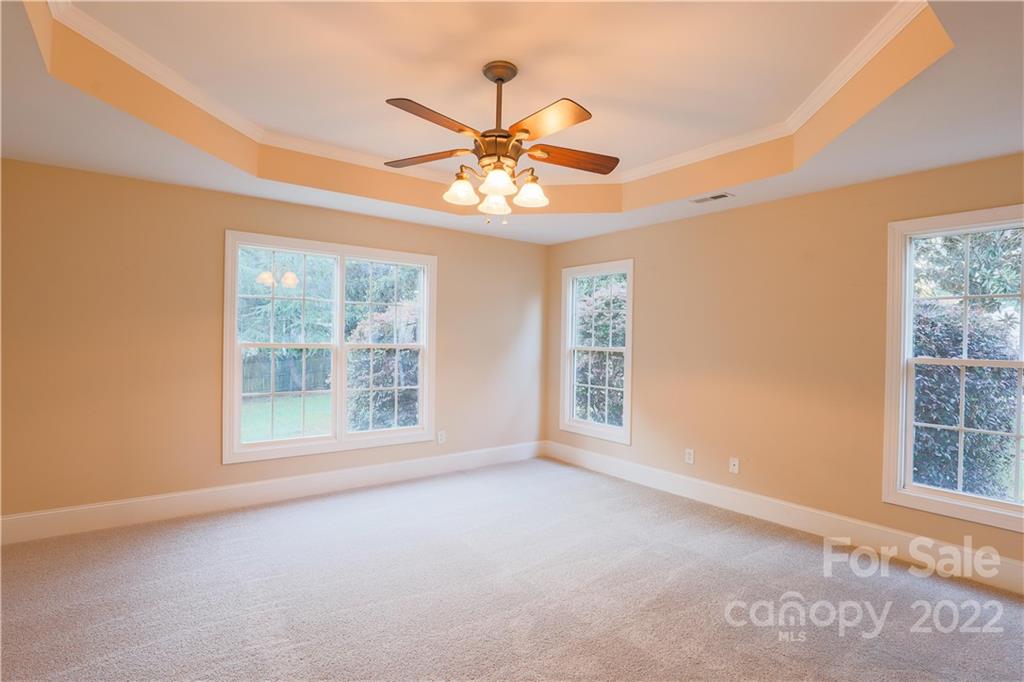 142 Princess Loop Troutman, NC 28166 - Photo 5 of 22 an empty room with windows and fan