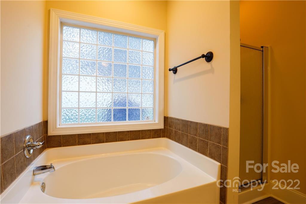 142 Princess Loop Troutman, NC 28166 - Photo 7 of 22 a bath tub sitting next to a window