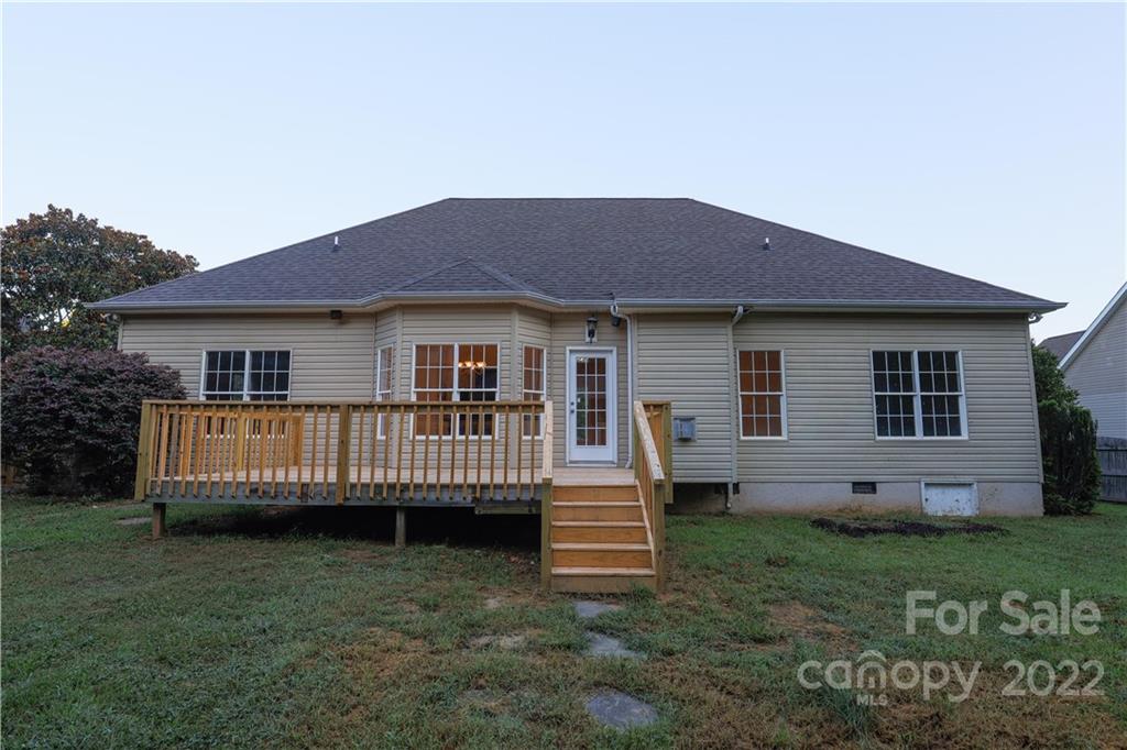 142 Princess Loop Troutman, NC 28166 - Photo 8 of 22 a view of a house with a yard and deck