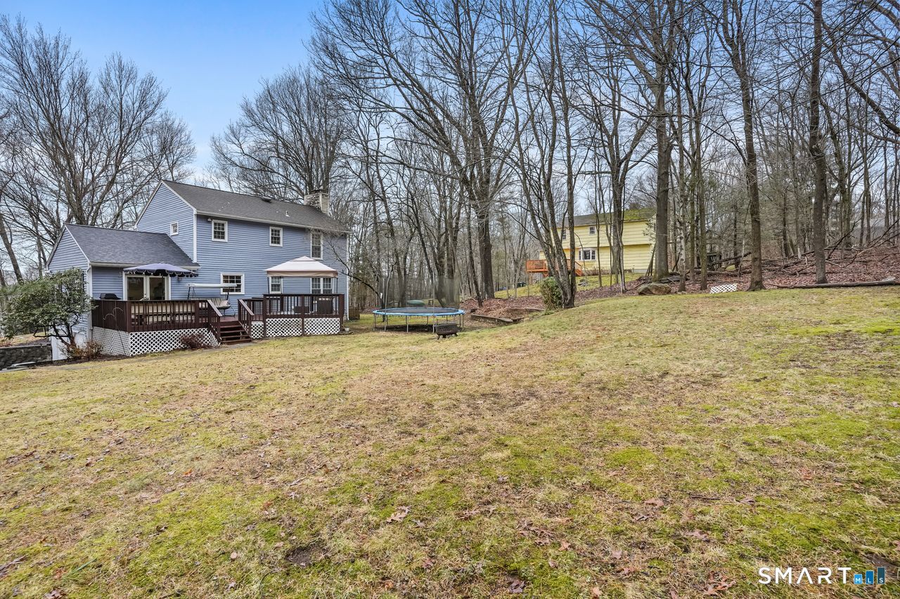 46 Little Brook Lane Newtown, CT 06470 - Photo 26 of 27 a swimming pool with outdoor seating and yard
