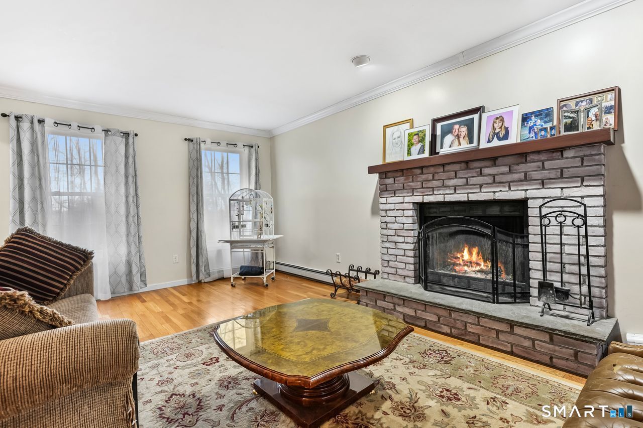 46 Little Brook Lane Newtown, CT 06470 - Photo 4 of 27 a living room with furniture and a fireplace