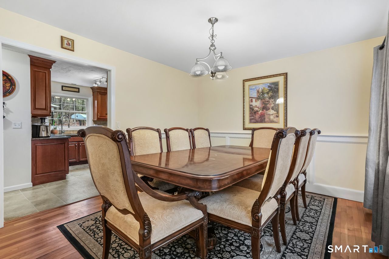 46 Little Brook Lane Newtown, CT 06470 - Photo 6 of 27 a view of a dining room with furniture