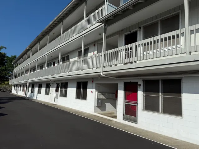 a front view of a building with a lot of windows