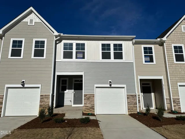 a front view of house with a yard