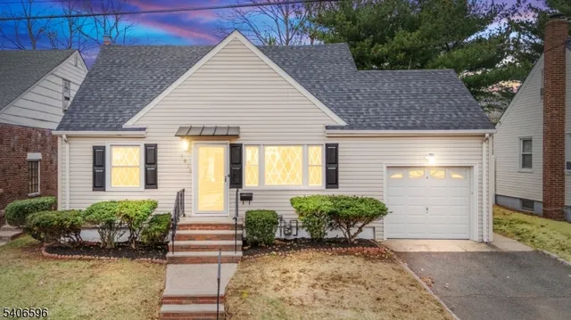 a view of a house with potted plants