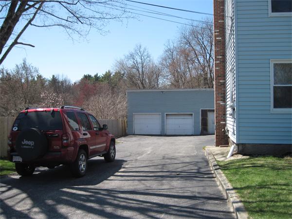 99 Center Bridge Road Lancaster, MA 01523 - Photo 3 of 30 a front view of a house with garden