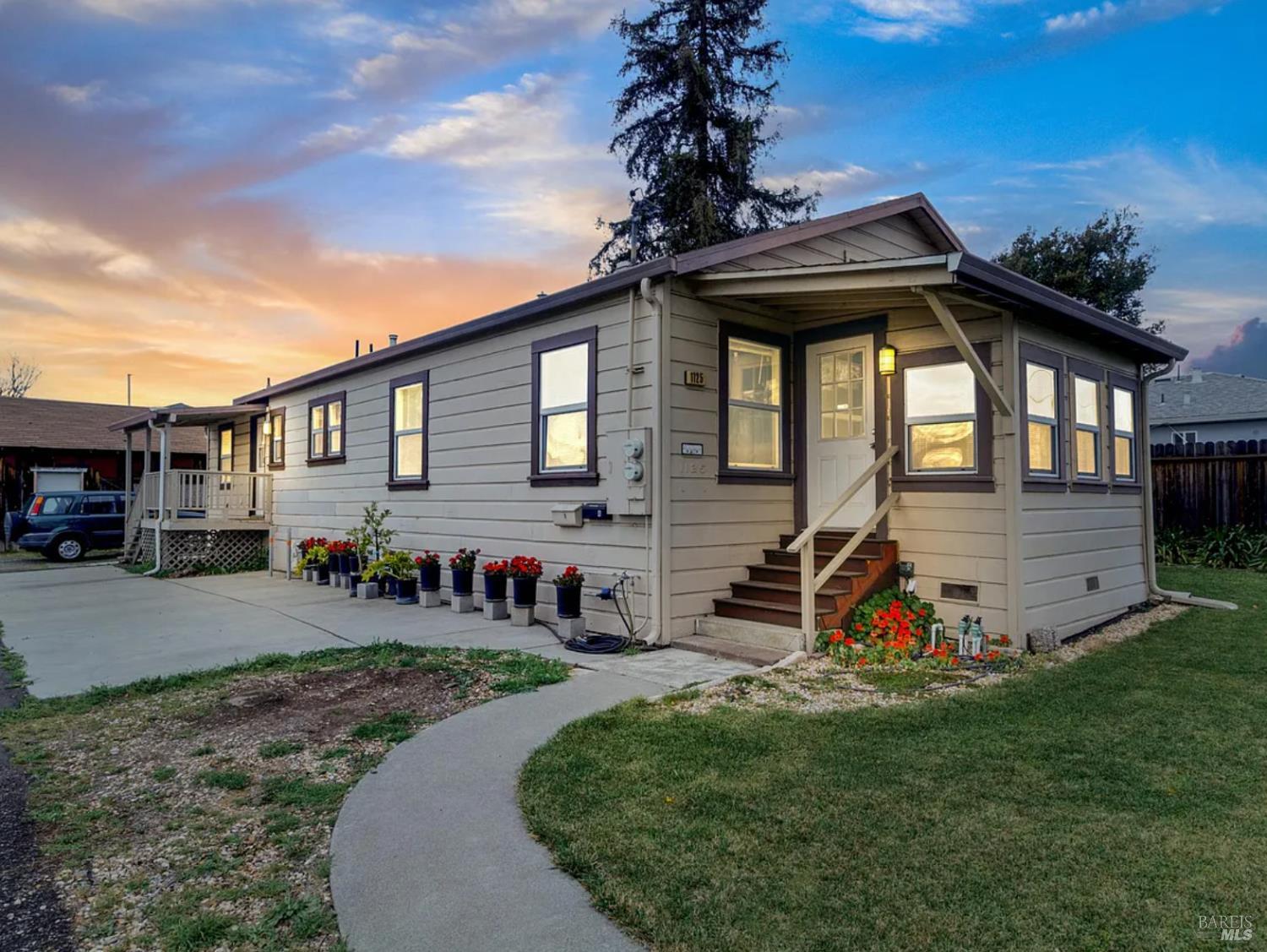 a front view of a house with garden