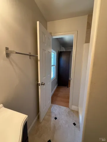 a view of a bathroom with a hallway