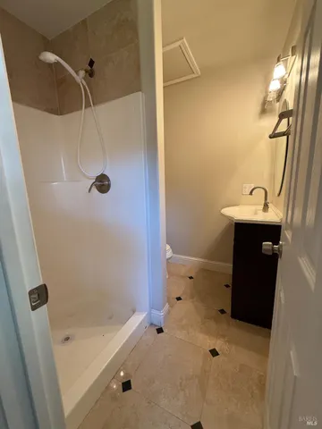 a bathroom with a sink and a shower