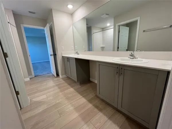 an empty room with closet and a bathroom