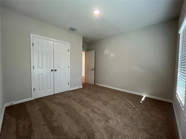 a bathroom with a double vanity sink toilet and a shower