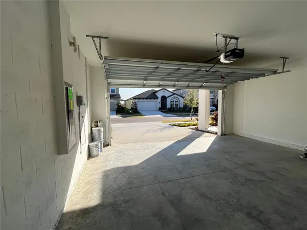 a view of a house with backyard and garden